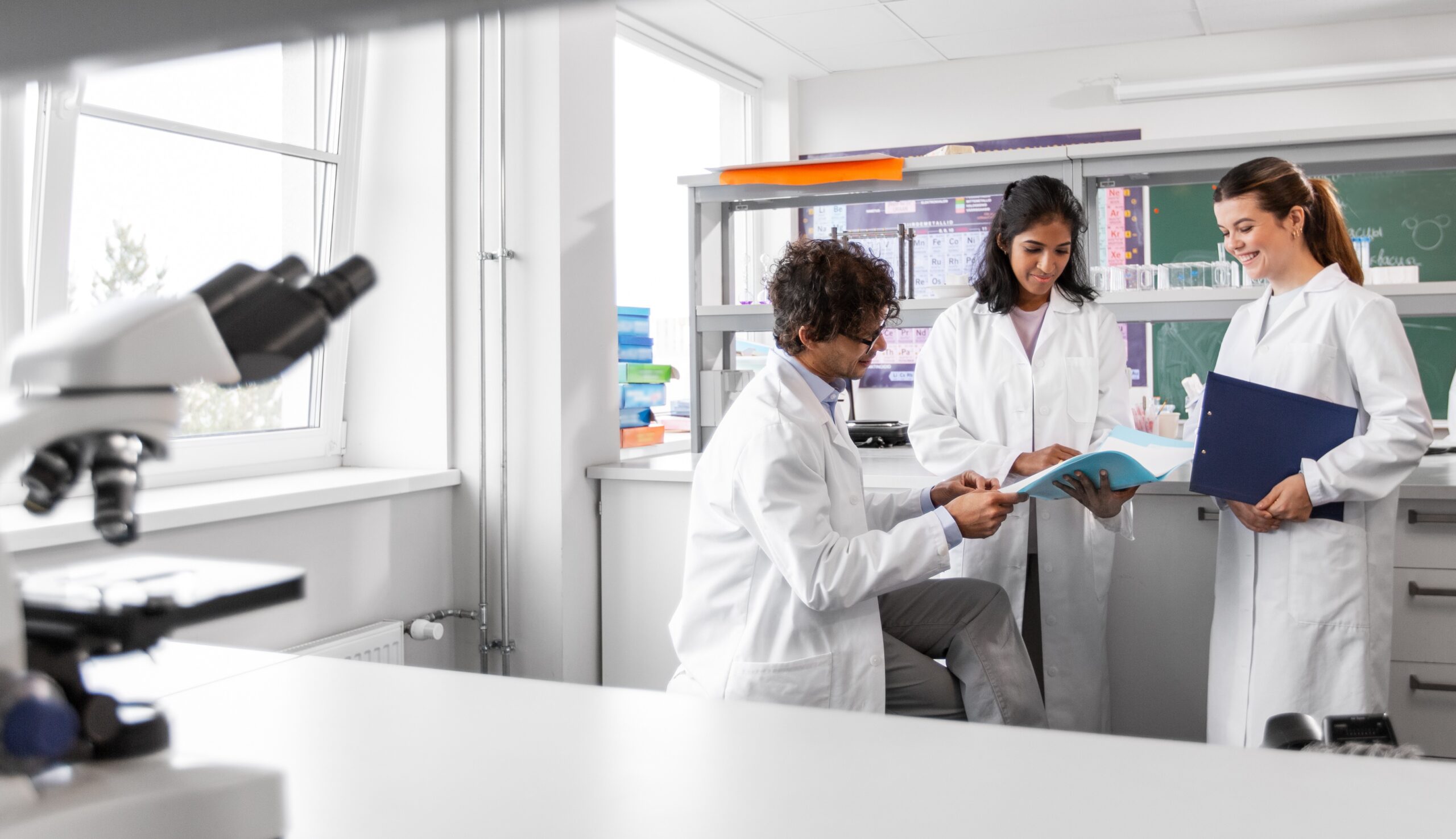 Lab Startup Steps for Infectious Disease Clinics_PhotoCredit_Syda Productions _AdobeStock_507761725 Doctors in white coats with charts in hand working in the laboratory.